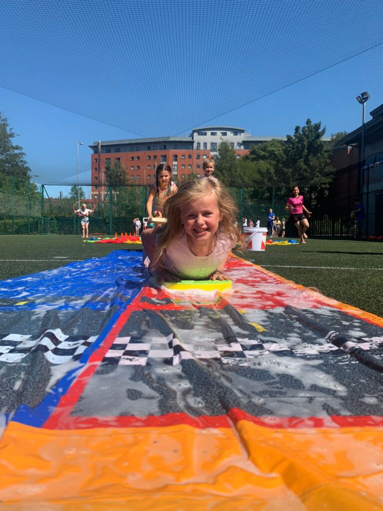 child using water slide
